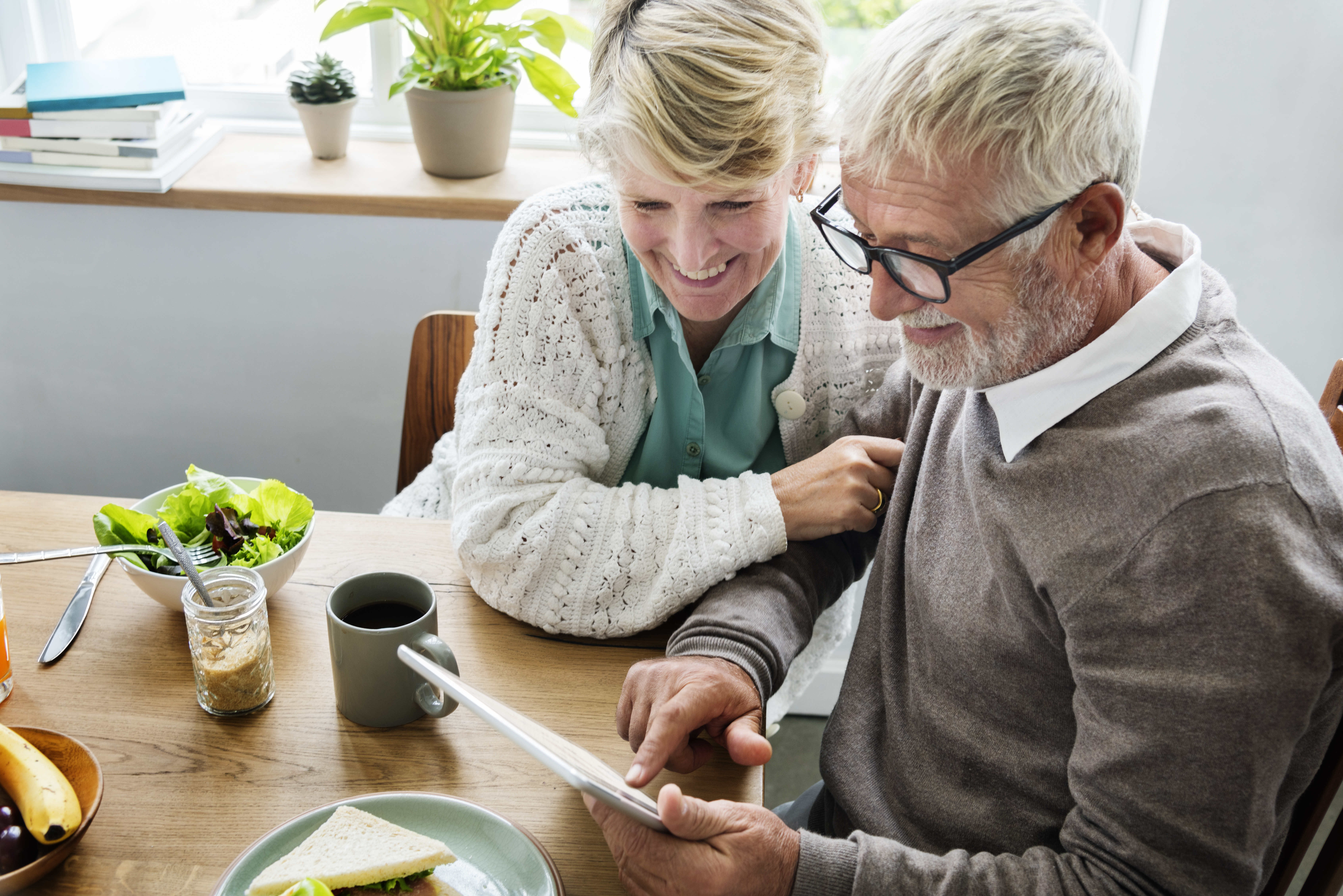 senior man and woman using tablet senior man and woman using tablet